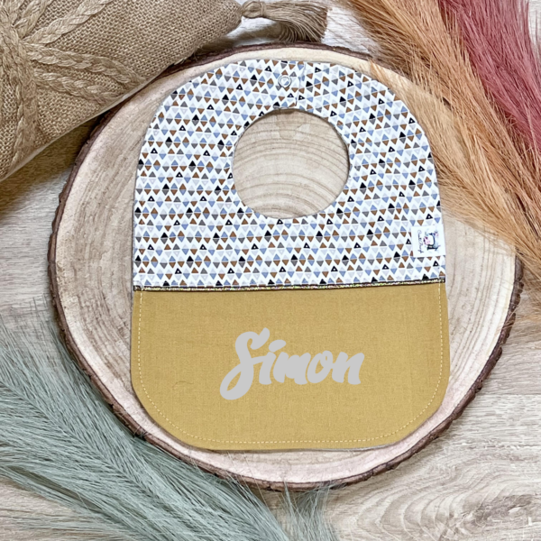 Bavoir bébé jaune à motifs géométriques
