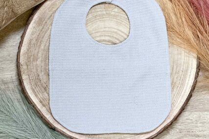 Bavoir bébé jaune à motifs géométriques